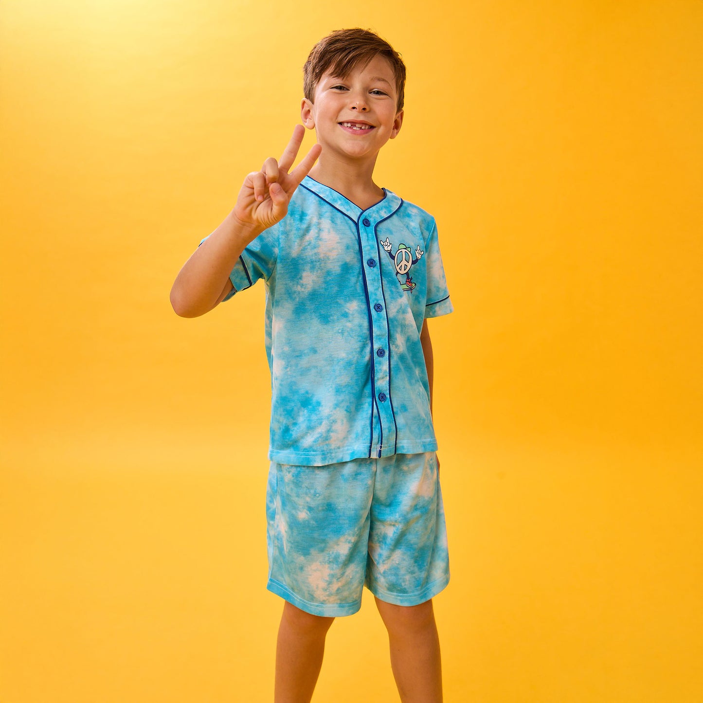 Tie Dye Skater; @A boy wearing Sport Jersey Short Pj Set with Tie Dye Skater print