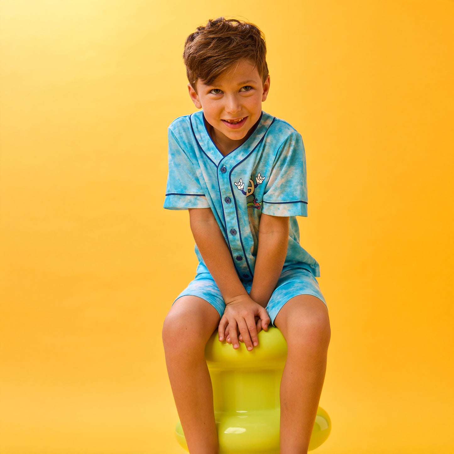 Tie Dye Skater; @A boy wearing Sport Jersey Short Pj Set with Tie Dye Skater print