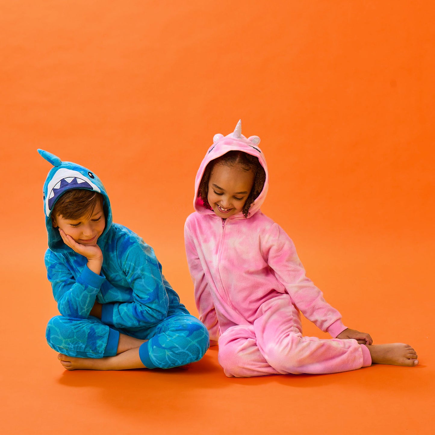 Unicorn;@A boy and a girl wearing Fleece Hooded Animal Onesie
