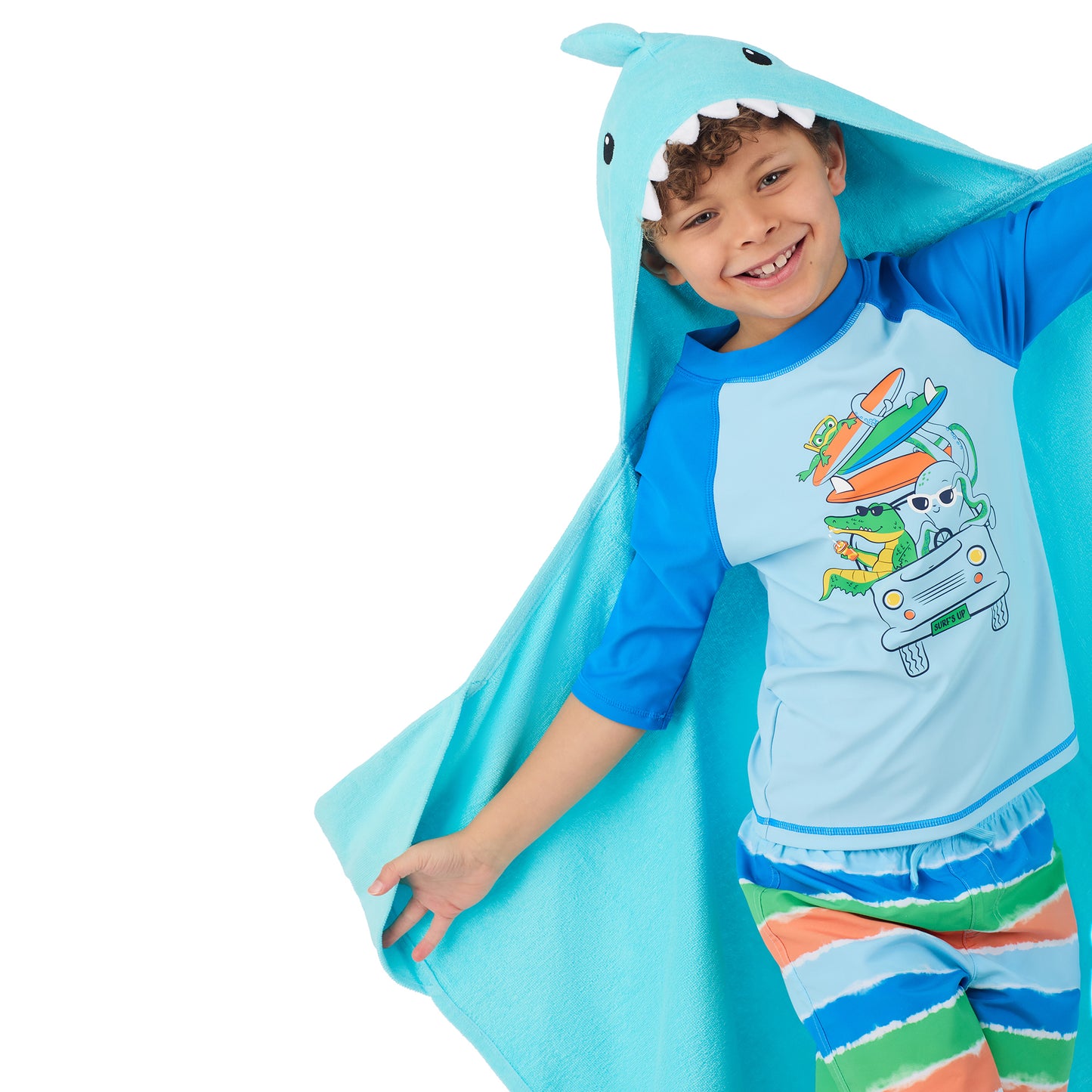 Fin-tastic Aqua & Seaweed Green;@A boy wearing 2 Pack Hooded Shark Towels in Fin-tastic Aqua & Seaweed Green