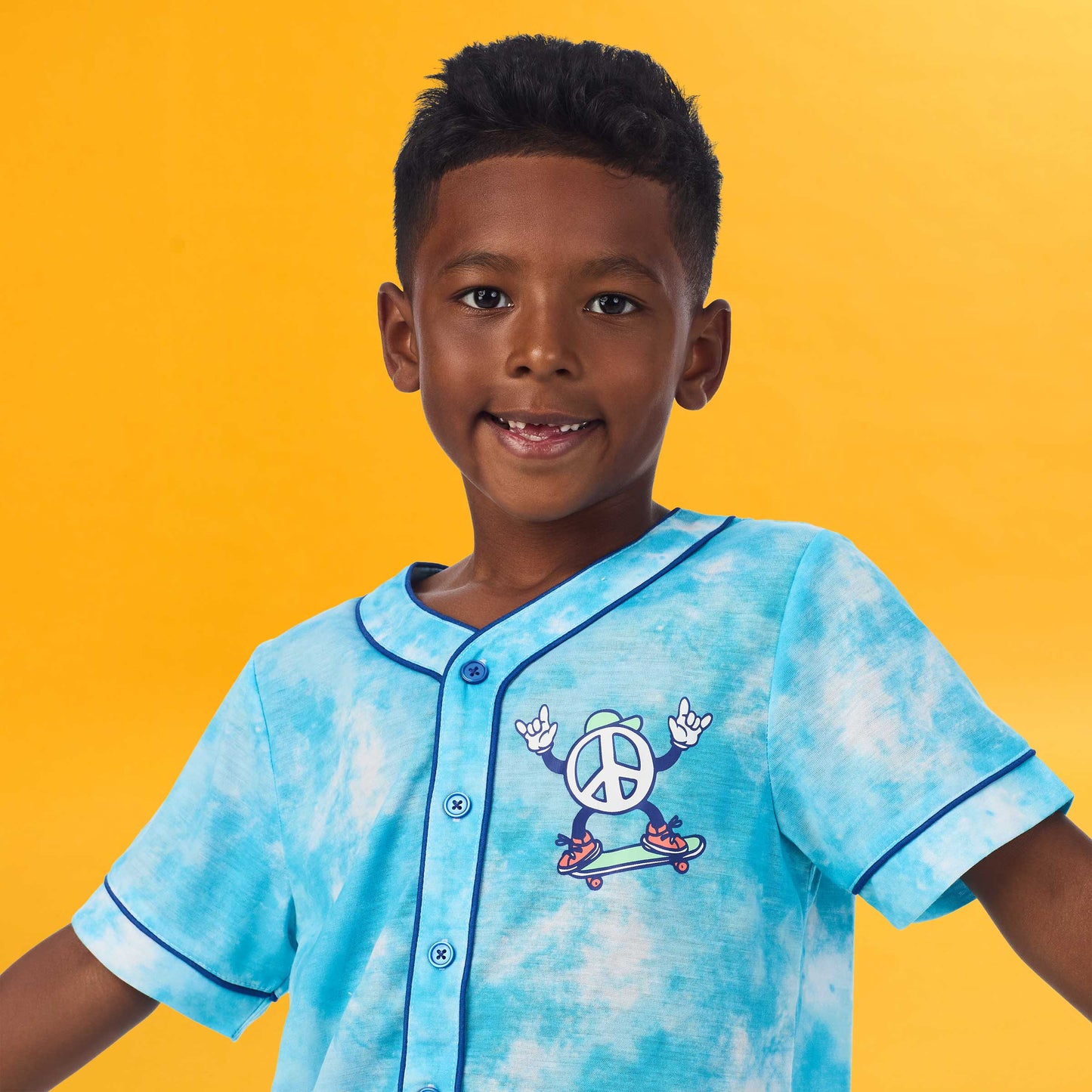 Tie Dye Skater; @A boy wearing Sport Jersey Short Pj Set with Tie Dye Skater print