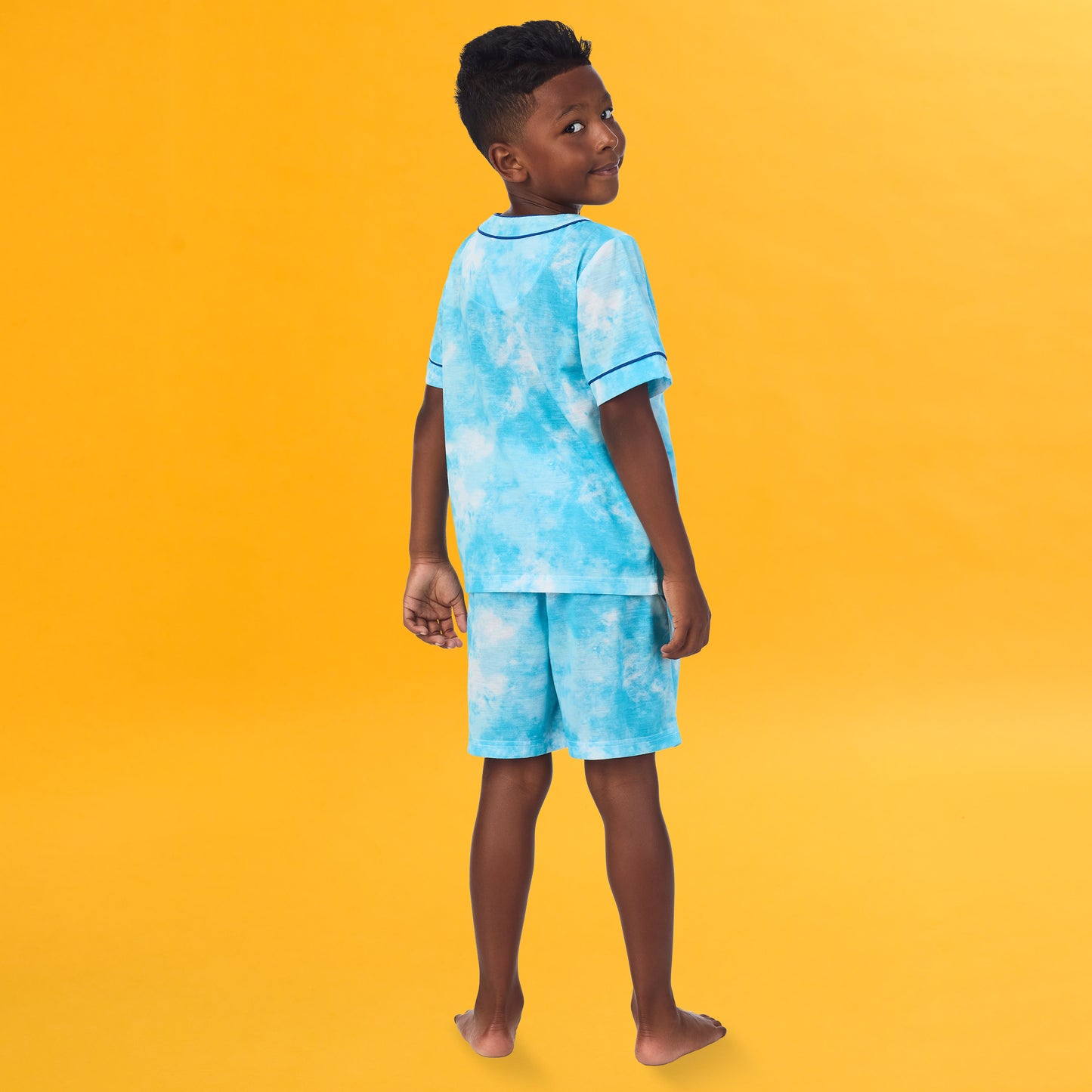 Tie Dye Skater; @A boy wearing Sport Jersey Short Pj Set with Tie Dye Skater print