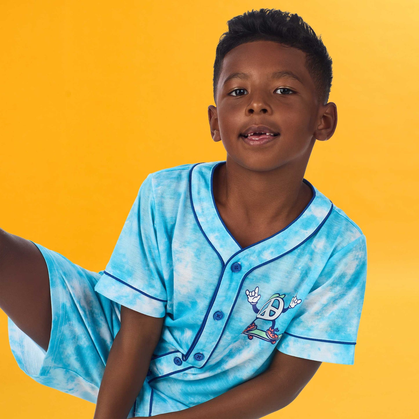Tie Dye Skater; @A boy wearing Sport Jersey Short Pj Set with Tie Dye Skater print