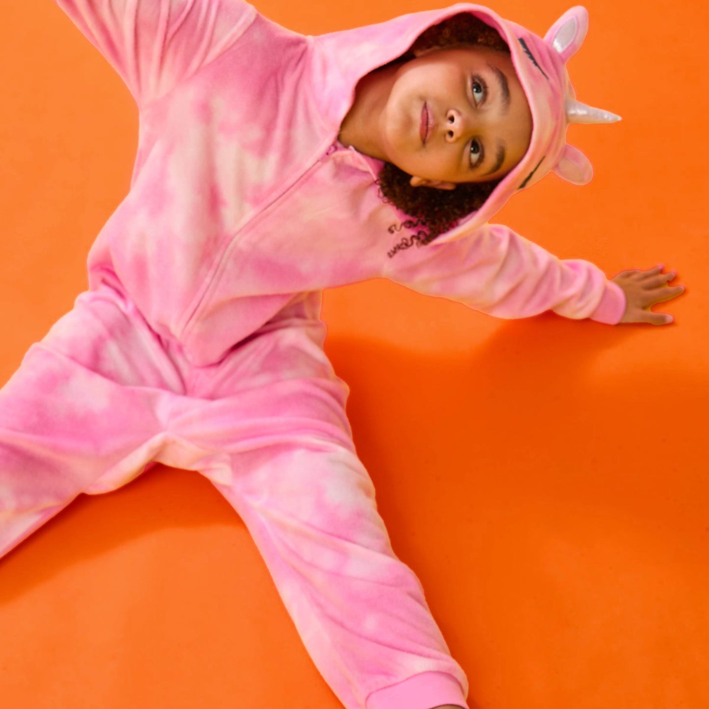 Unicorn;@A girl wearing Fleece Hooded Animal Onesie