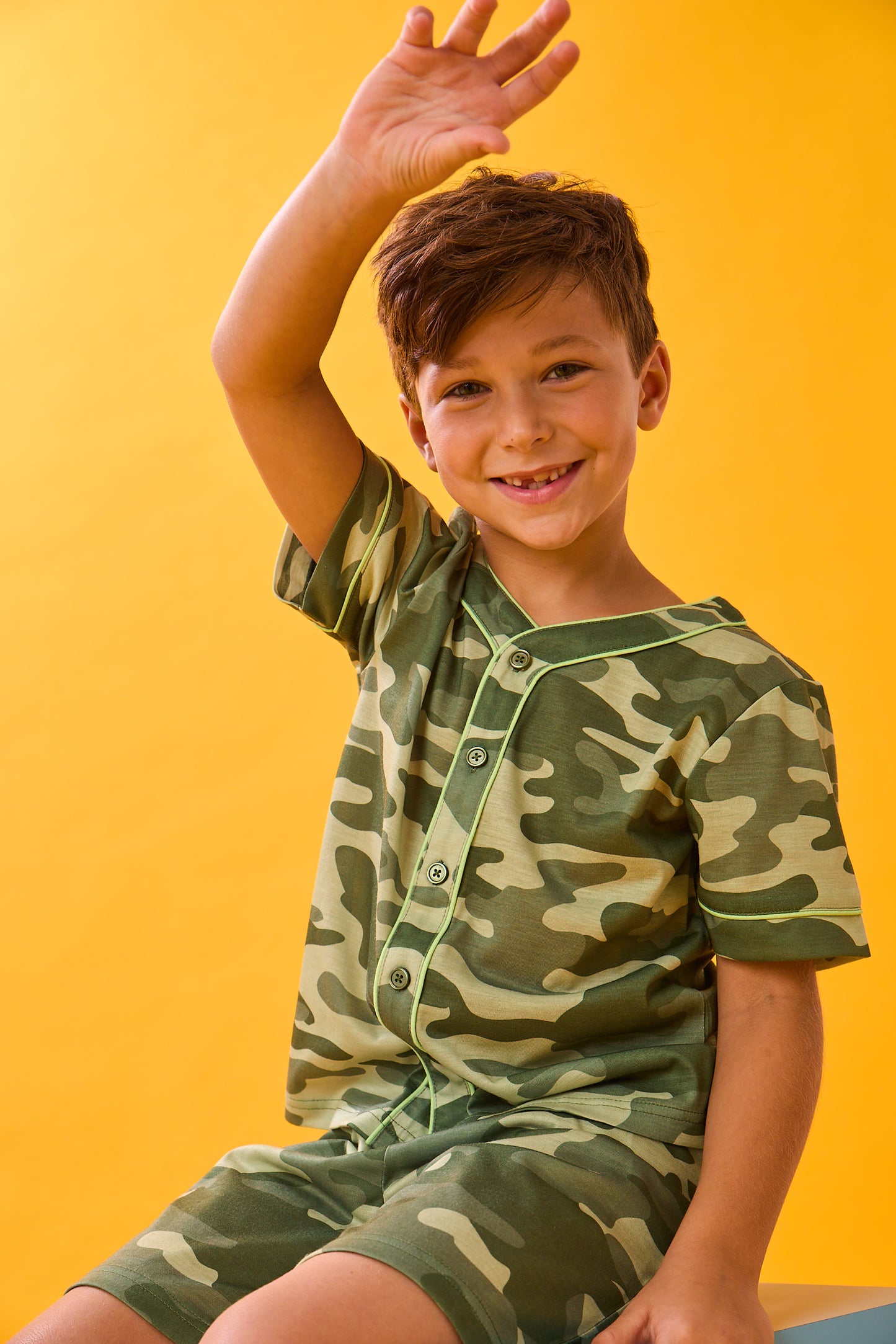 A boy wearing Sport Jersey Short Pj Set with camo print