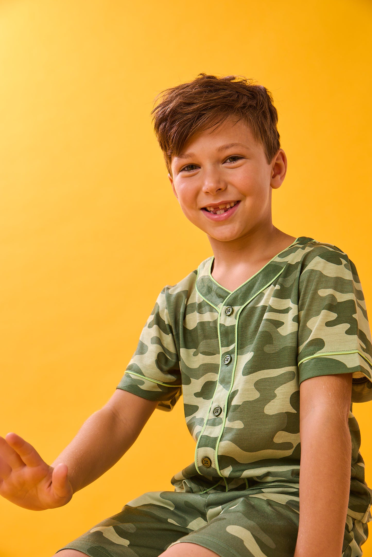 A boy wearing Sport Jersey Short Pj Set with camo print