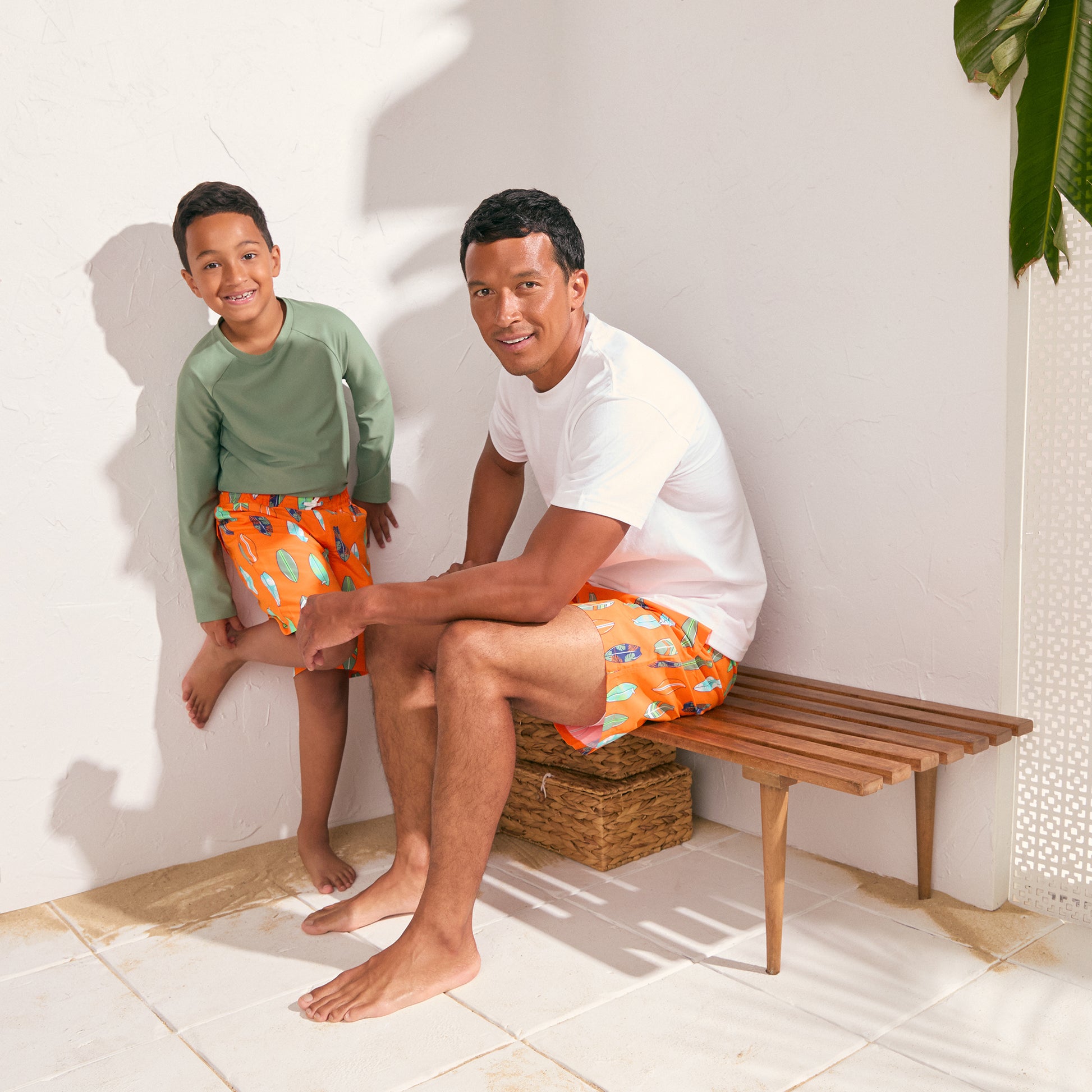 Coastal Tangerine;@A man and a boy wearing Swim Trunks in Coastal Tangerine

