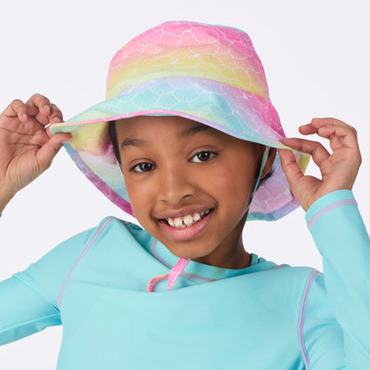 Rainbow Seashells;@A girl wearing UPF 50 Sun Hat in Rainbow Seashells
