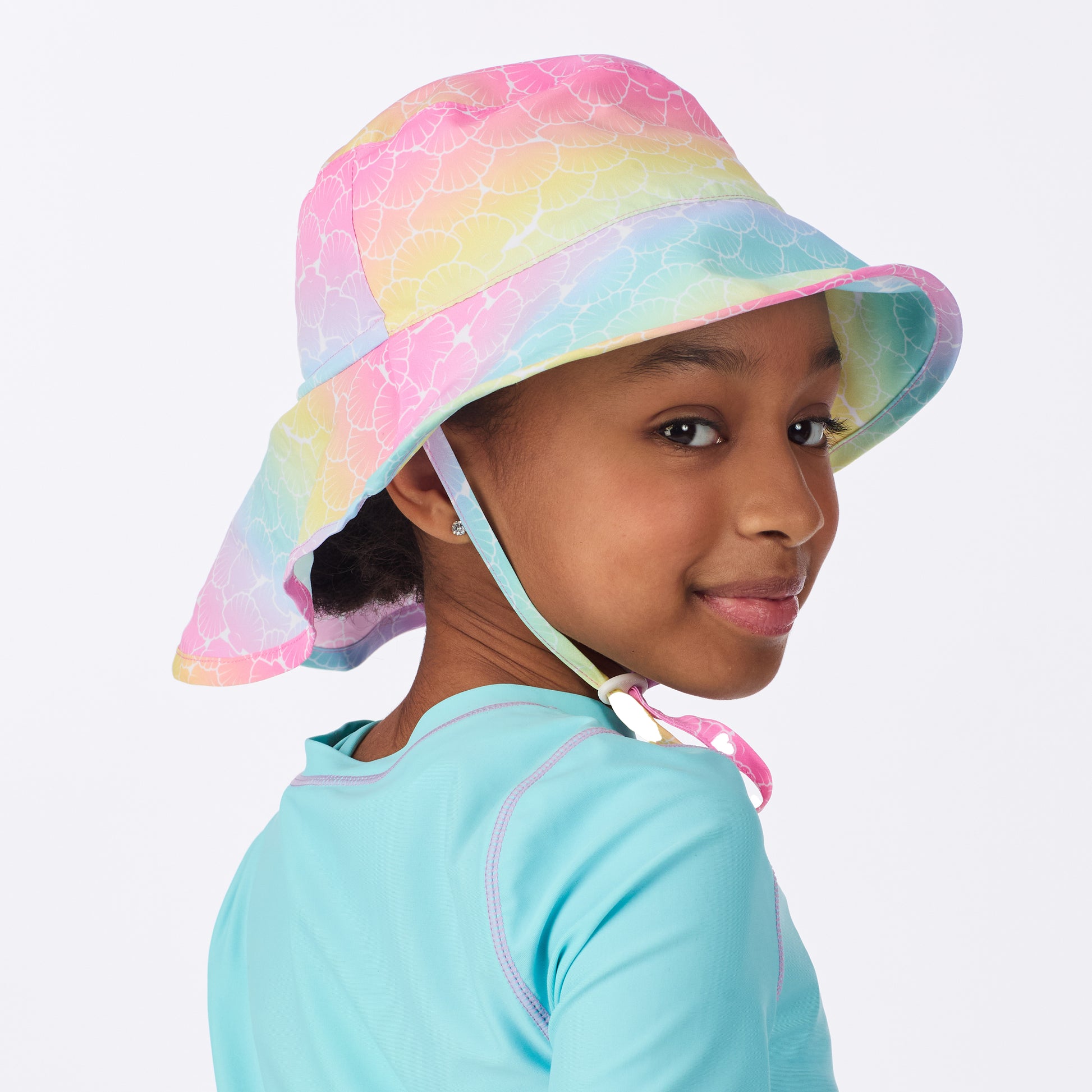 Rainbow Seashells;@A girl wearing UPF 50 Sun Hat in Rainbow Seashells

