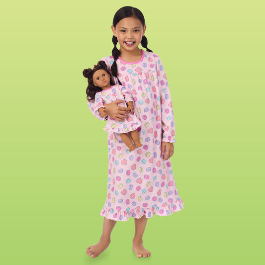 A girl wearing Doll & Me Long Sleeve Ruffle Nightgown